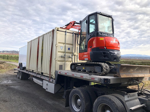 Enclosed Trailer loaded with construction equipment