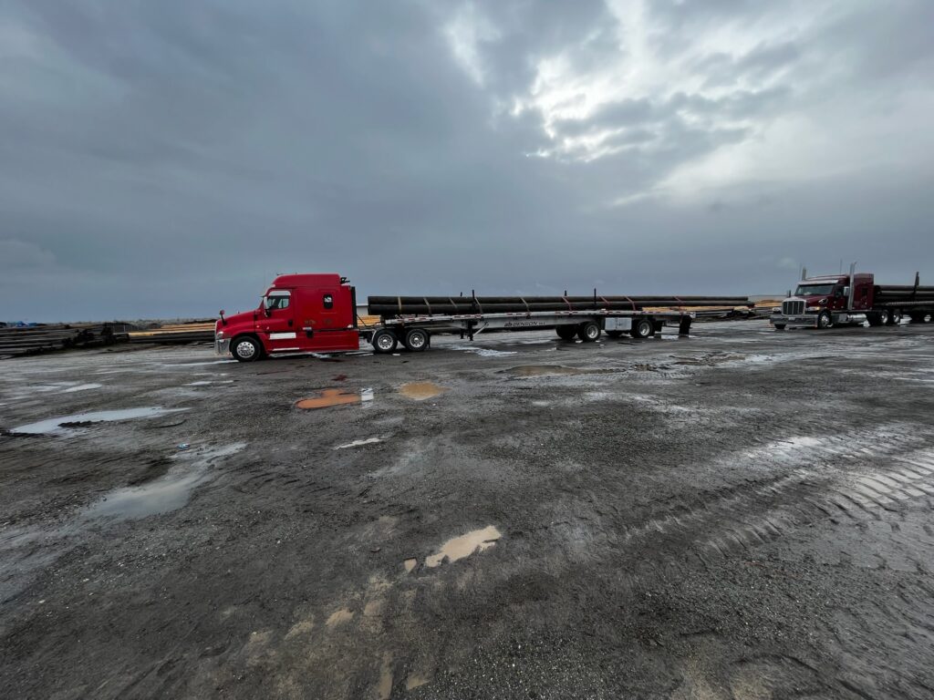 100' Wooden Poles to Electric/Phone Lines