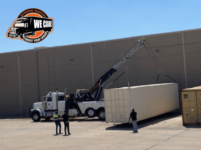 loading a shipping container on a trailer