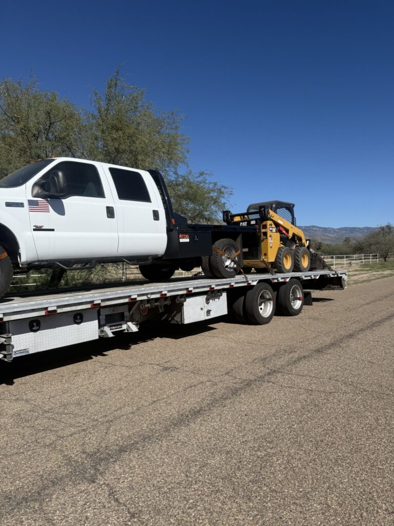 Ford F550 flatbed & CAT 232D Skid Steer Loader