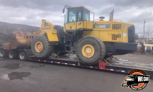Transporting a Komatsu WA500-6 Wheel Loader.
