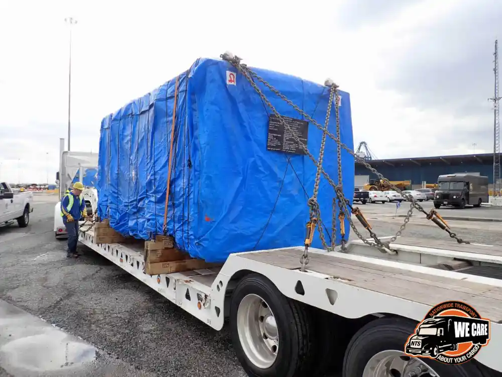 Hauling a tarped container.